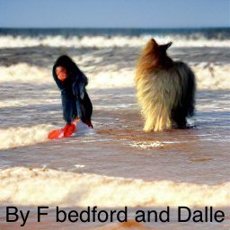 girl in hoodie and collie in the ocean