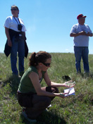 Kacy Hollenback holds a plant identified by the elders at Lake Sakakawea