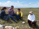 Blackfeet elders regale UA researchers Kacy Hollenback and MNZ at the fort site (MATL)