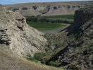 At the Sullivan Bridge site, the cliffs cut away to reveal the headwaters of the Upper Marias River (MATL)